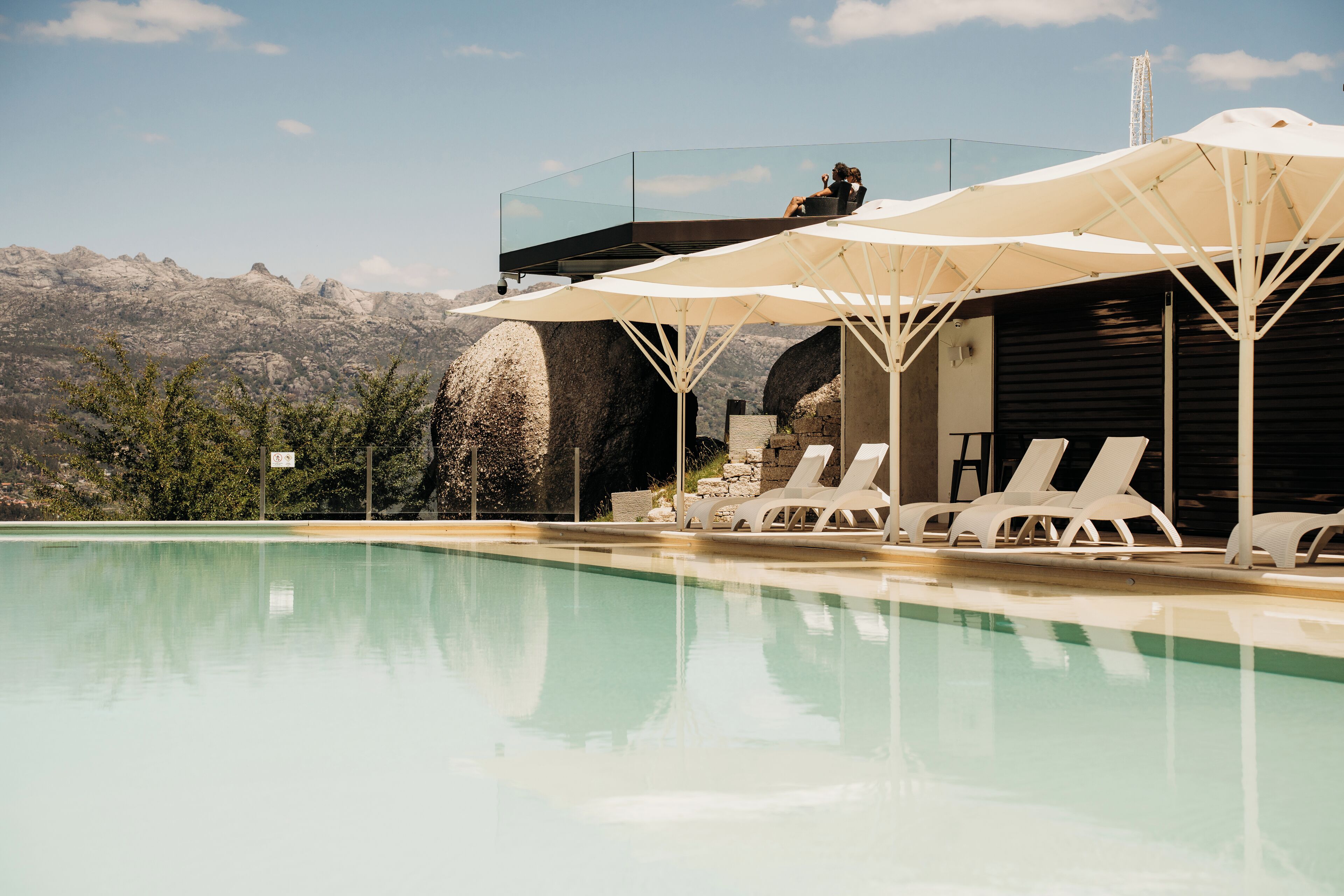 Indoor pool, outdoor pool, open 10:00 AM to 8 PM, pool umbrellas