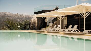 Indoor pool, outdoor pool, open 10:00 AM to 8 PM, pool umbrellas