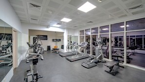 A gym with treadmills, ellipticals, and weight machines. - Nooa Hotel Ras Al Khaimah (Ras Al Khaimah)