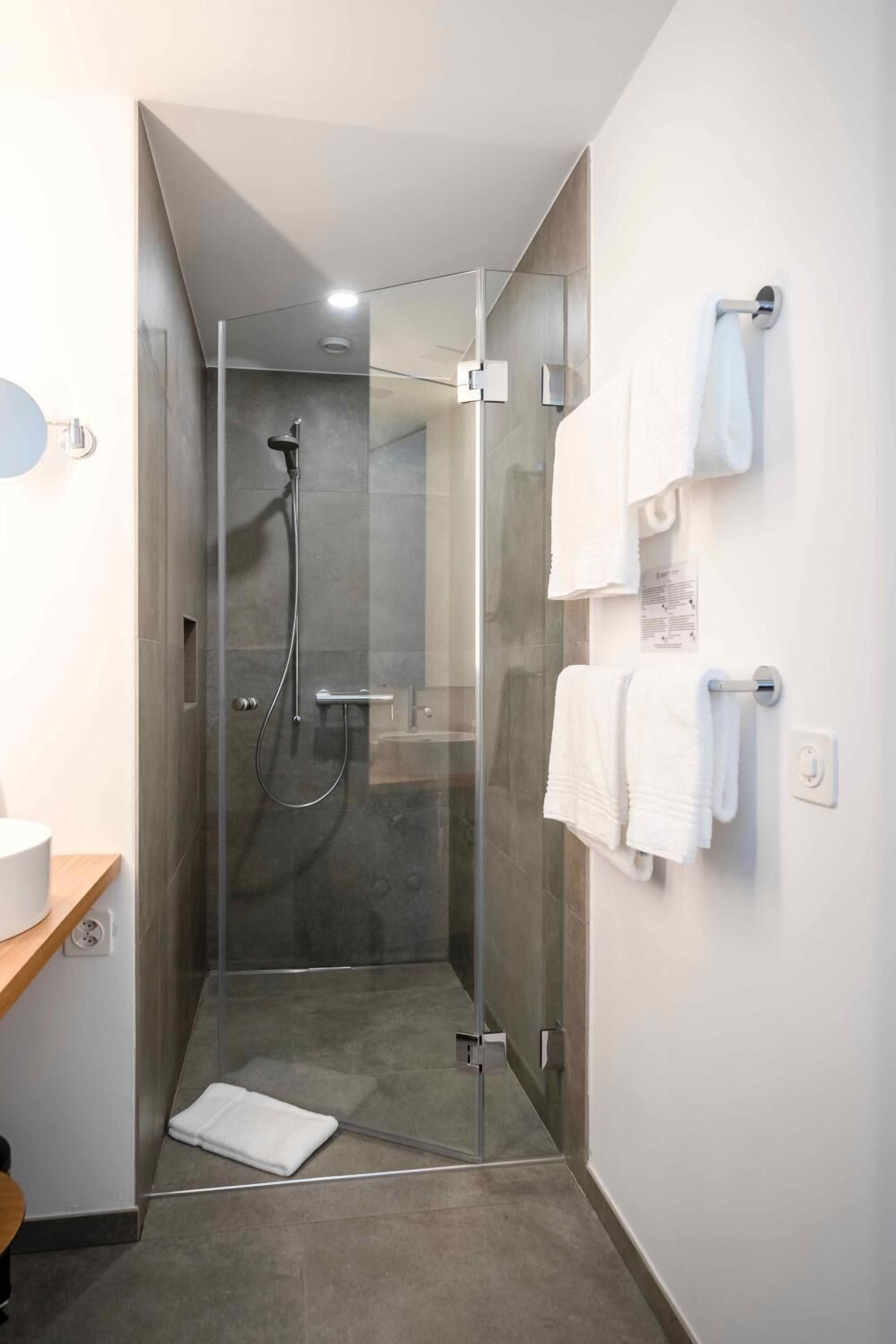 shower, designer toiletries, hair dryer, bathrobes