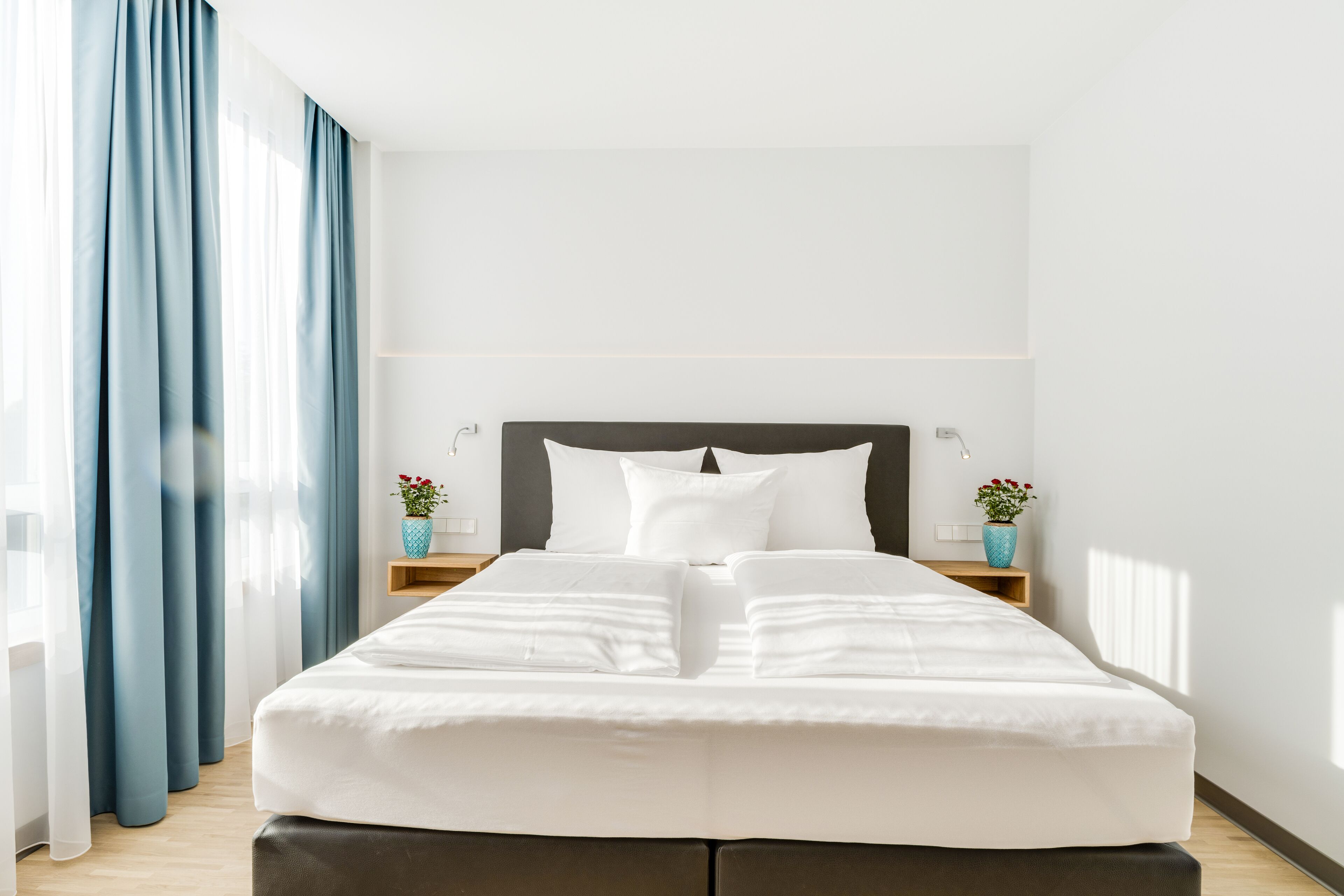 hypo-allergenic bedding, desk, laptop workspace, blackout curtains