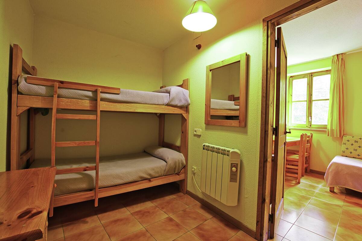 Desk, blackout curtains, free cots/infant beds, free WiFi