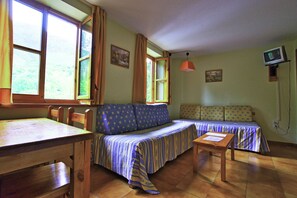 Desk, blackout curtains, free cots/infant beds, free WiFi