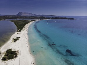 Beach nearby, white sand, beach shuttle, beach umbrellas