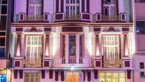 A hotel with a classic facade, ornate balconies, and a prominent 'HOTEL' sign. - Hotel Praça da Matriz (Porto Alegre)