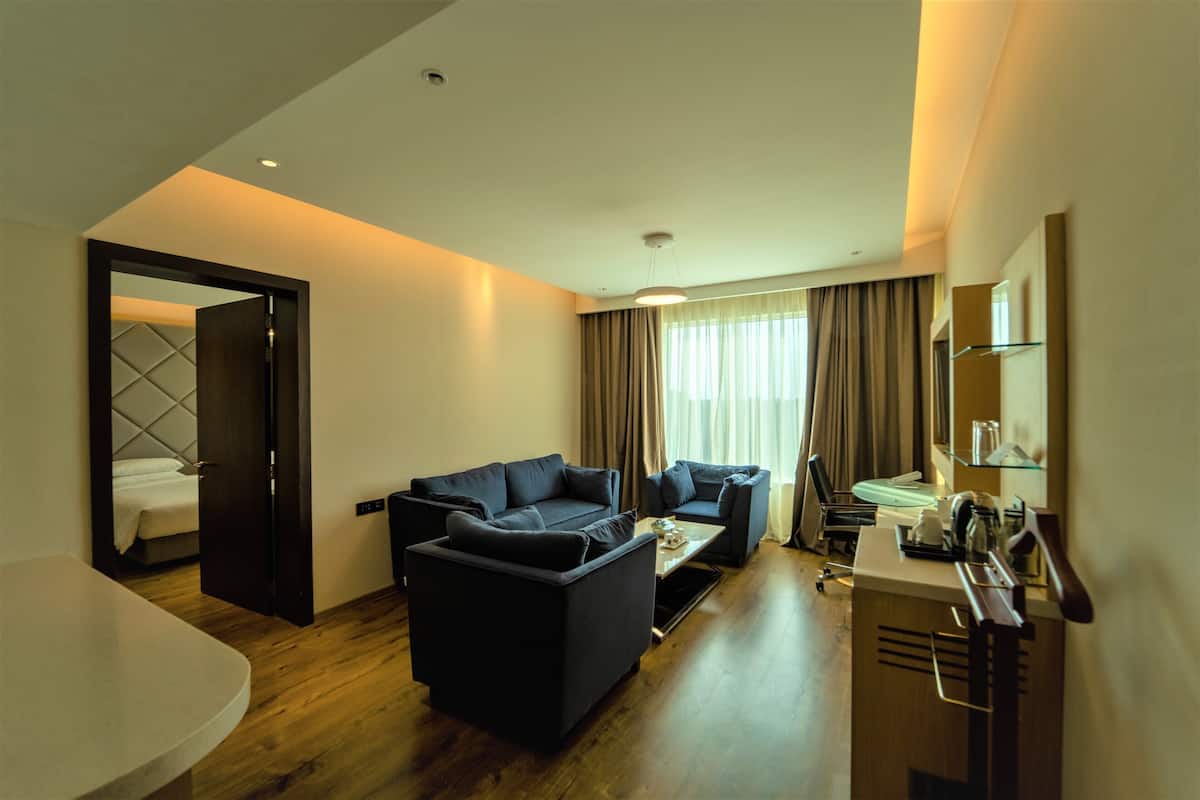 suite, 1 bedroom, non smoking | living area | 42-inch led tv with satellite channels, tv, offices