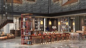 A spacious lobby with a central bar area, high ceilings, and a staircase. - Renaissance Xi'an Hotel (Xi'an)