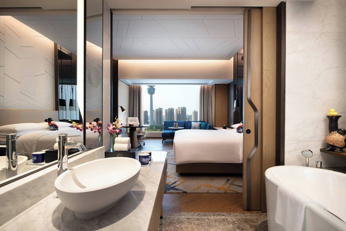 club king | bathroom | deep-soaking bathtub, hair dryer, slippers, towels