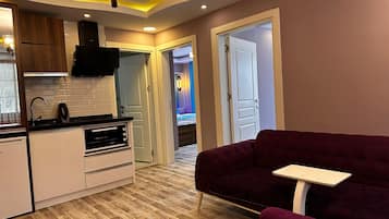 Family Suite, Lake View | Private kitchen | Fridge, eco-friendly cleaning products, paper towels