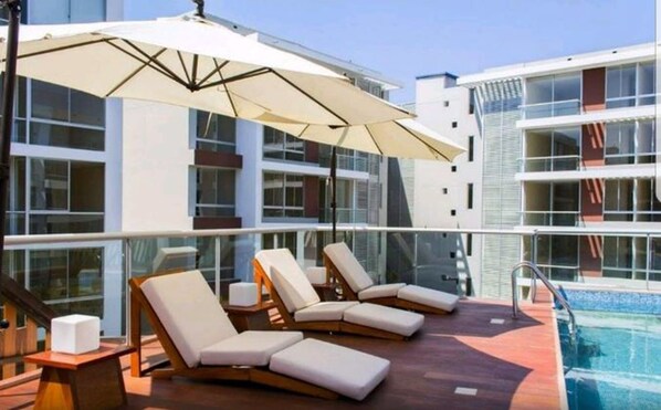 Outdoor pool, open 7:30 AM to 6:00 PM, pool umbrellas, pool loungers