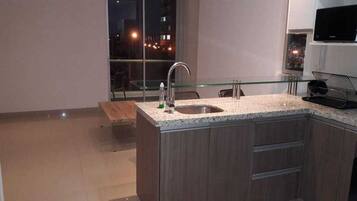 Executive Apartment, 1 Bedroom, Accessible, Garden Area | Living room | 50-inch flat-screen TV with cable channels, TV