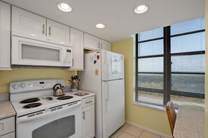 Coffee/tea maker, fridge, microwave, oven