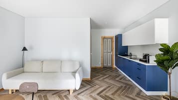 Standard Apartment, 1 Bedroom, Accessible | Living room | Flat-screen TV