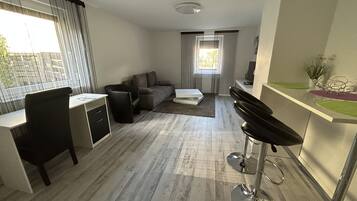 Basic Apartment, 1 Double Bed, Non Smoking | Living area | Flat-screen TV