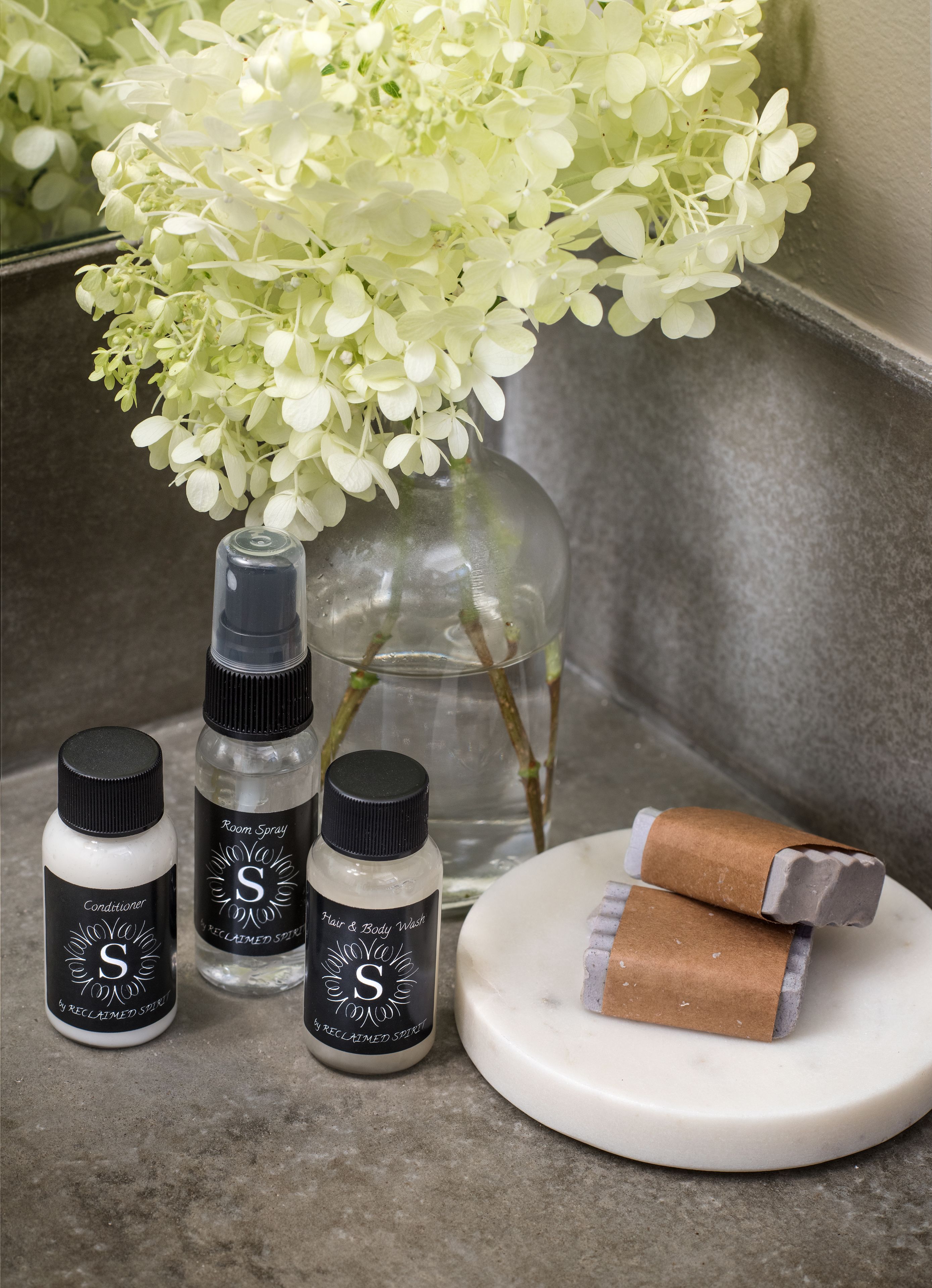 deep-soaking bathtub, rainfall showerhead, designer toiletries