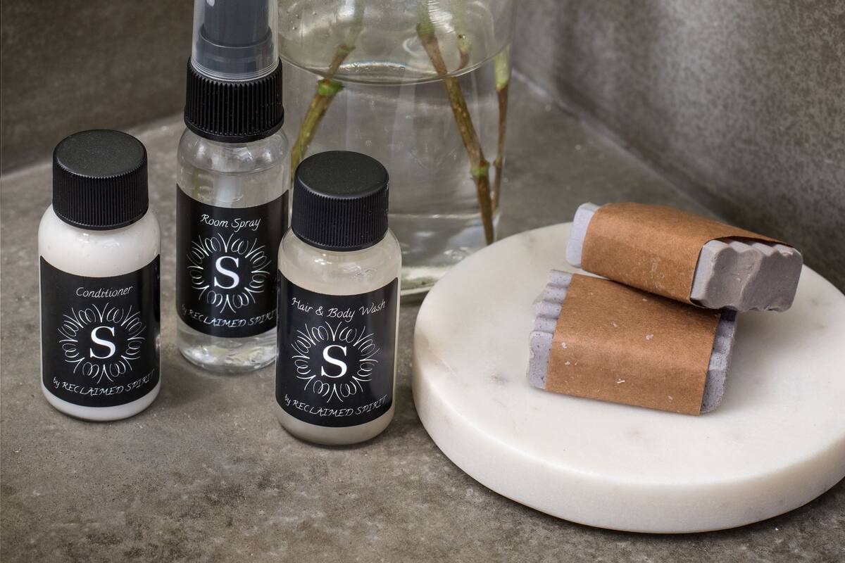 deep-soaking bathtub, rainfall showerhead, designer toiletries