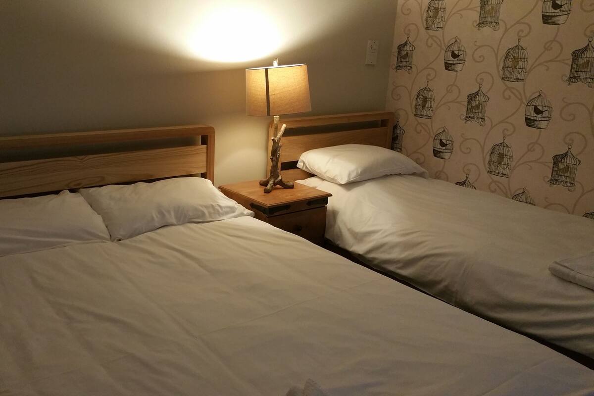 Family Room | Desk, blackout drapes, iron/ironing board (on request), WiFi (free)
