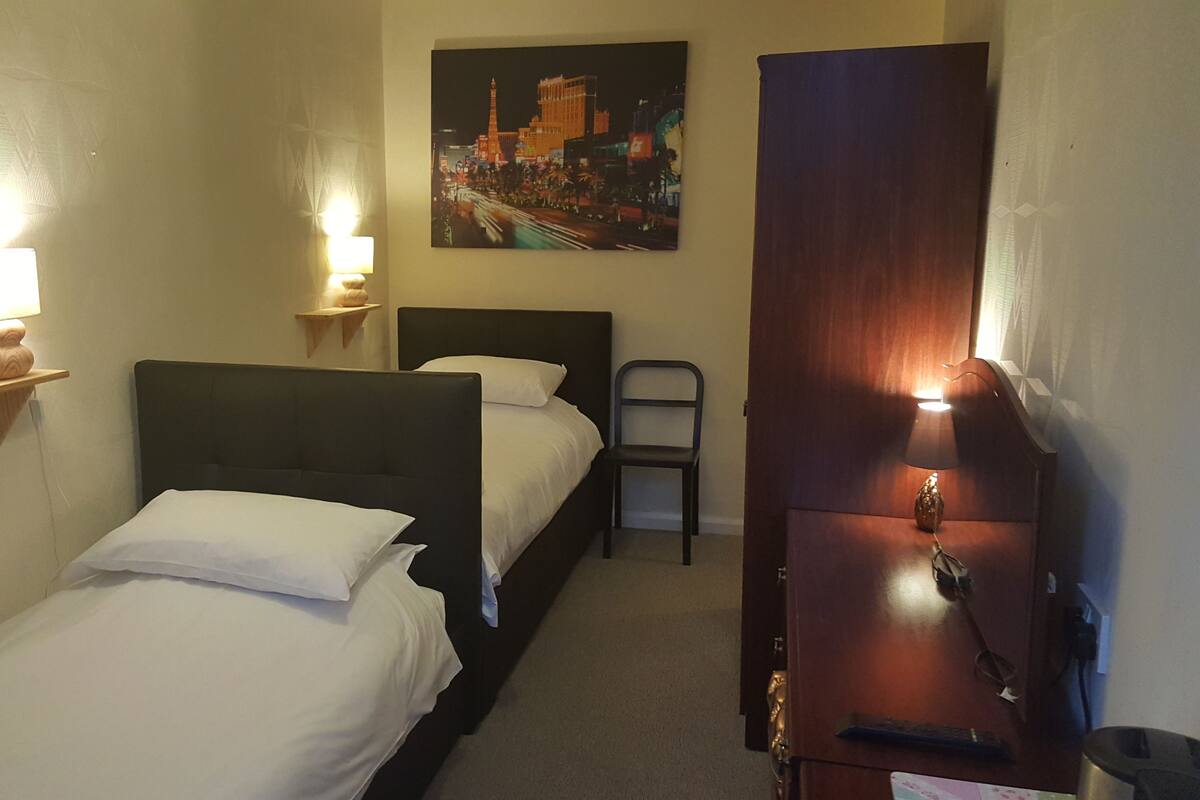 Twin Room | Desk, blackout drapes, iron/ironing board (on request), WiFi (free)