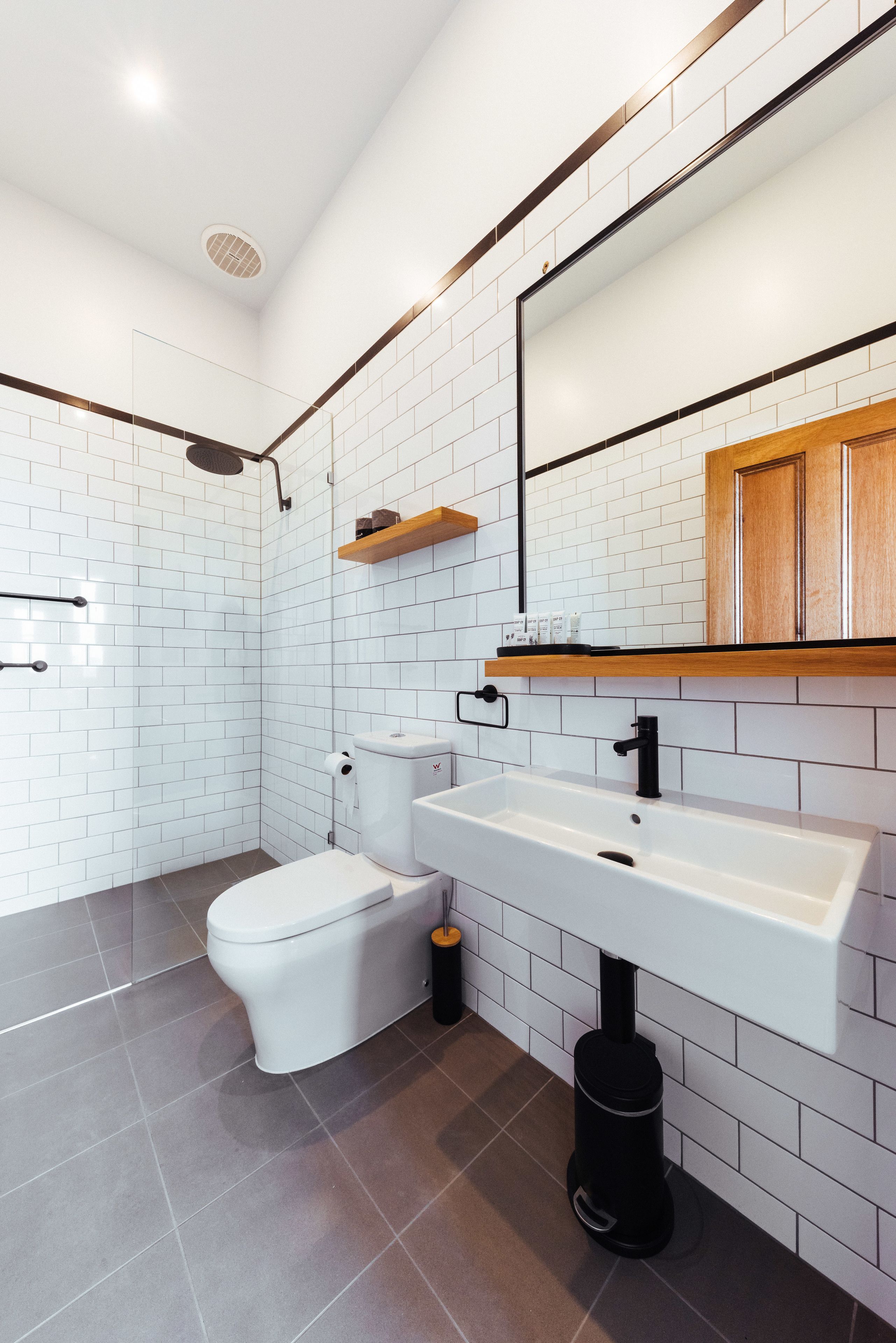 deluxe studio suite | bathroom | shower, hair dryer, towels