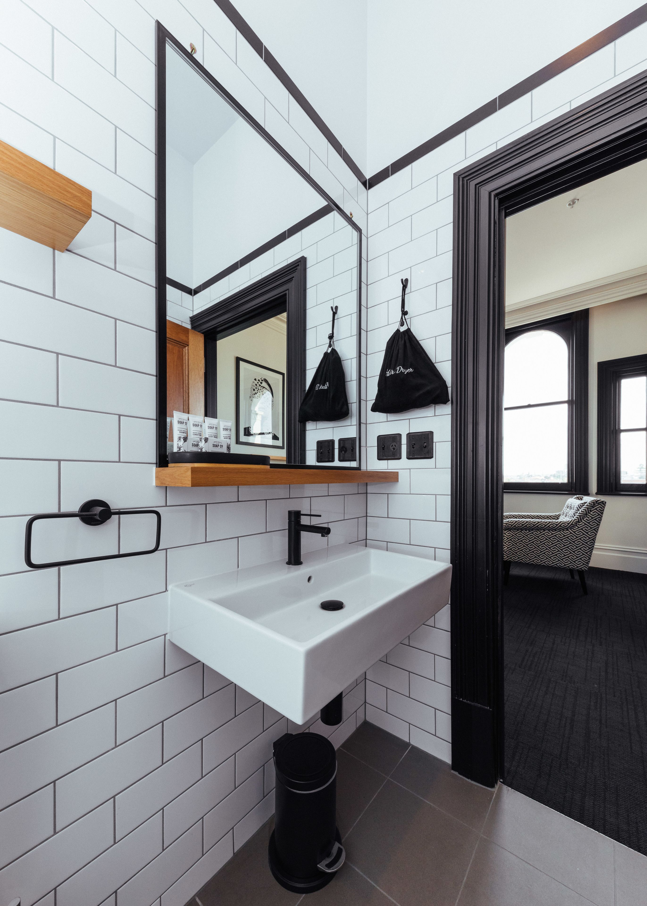 deluxe studio suite | bathroom | shower, hair dryer, towels