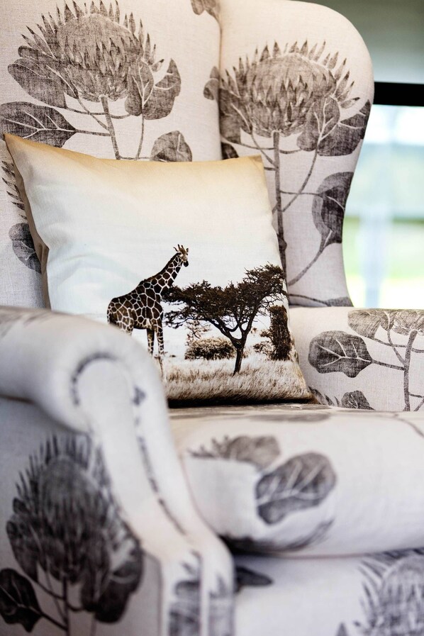A sofa with a giraffe and tree design. - Wimbledon Terrace House, by Veeve (London)