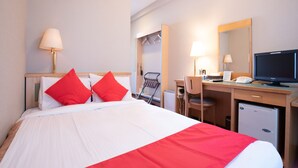 A hotel room with a bed, desk, chair, and a television. - Business Hotel Apple (Nagoya)