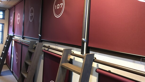 A row of hotel rooms with numbers 107, 108, and 109 on the walls. - Guest House One More Heart at NARA TOKI - Caters to Women - Hostel (Nara)