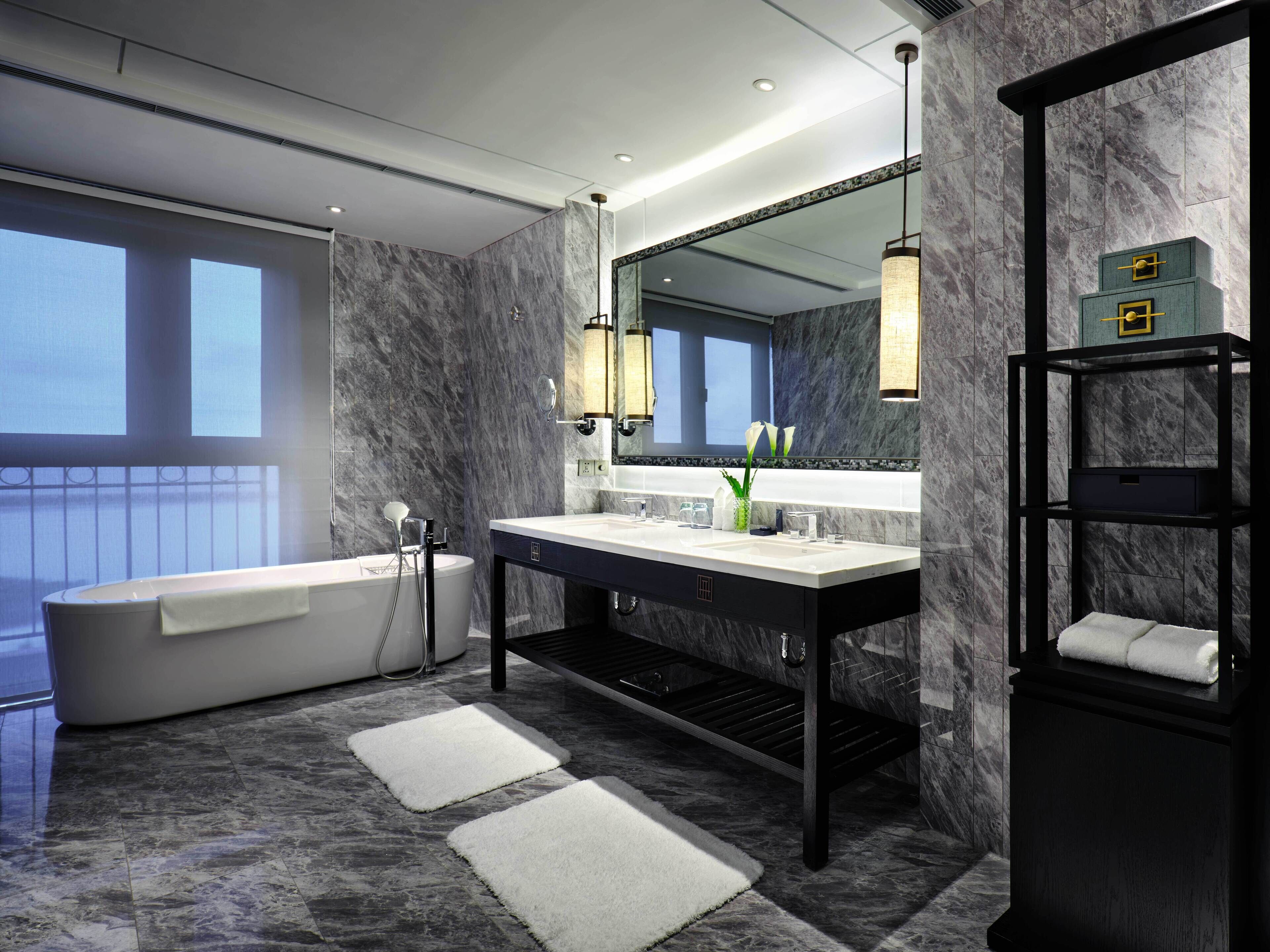 separate bathtub and shower, hair dryer, bathrobes, slippers