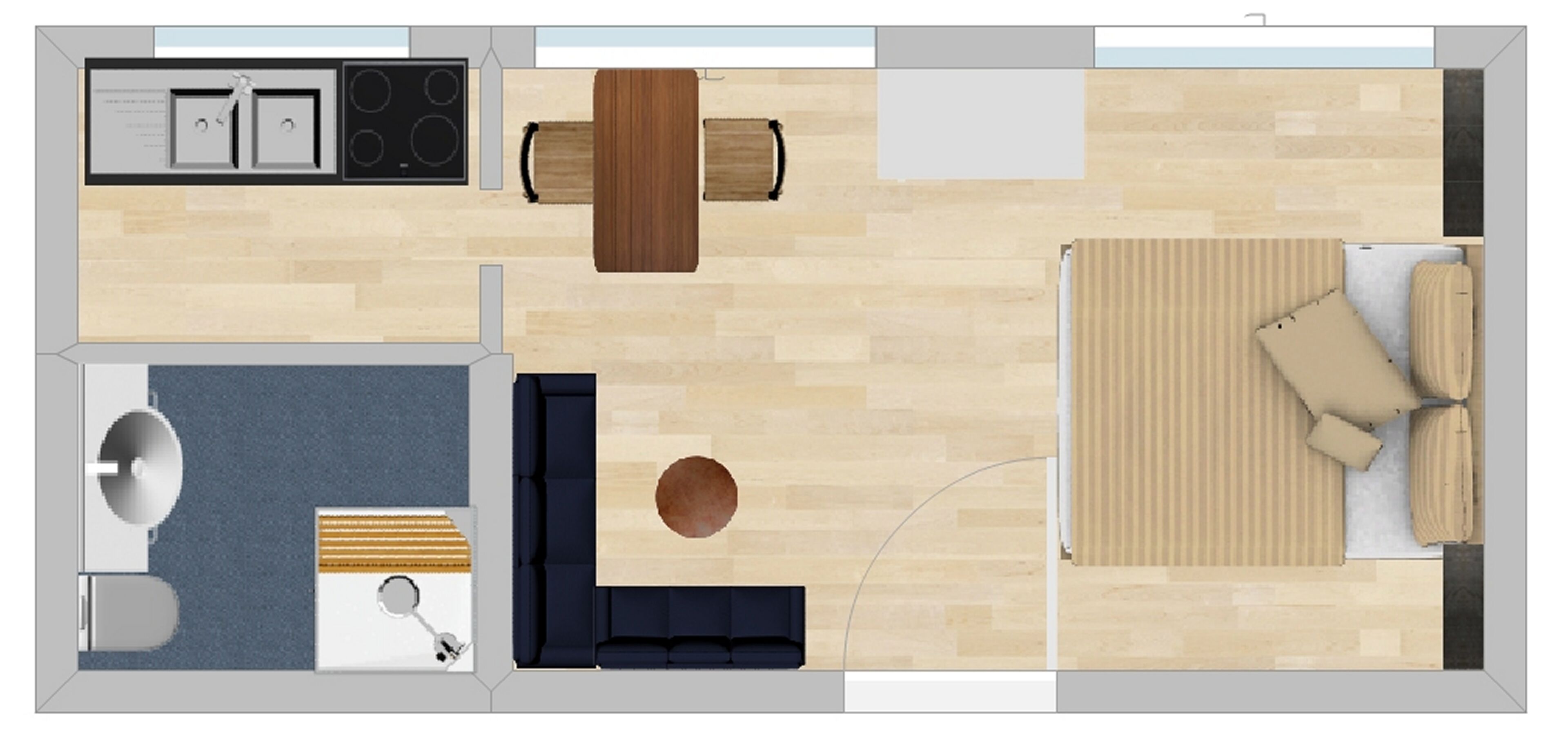 Ein Grundriss eines Hotelzimmers mit Küche, Essbereich, Wohnzimmer mit Sofa und rundem Tisch sowie einem separaten Badezimmer.