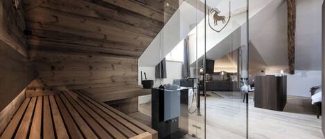 A modern interior with wooden slats, a glass partition, and a visible kitchen area.
