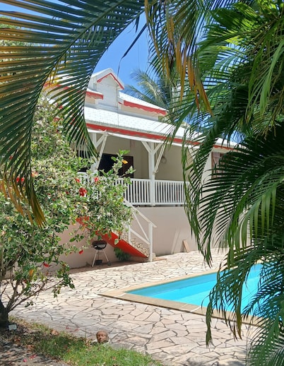 Creole villa with pool in tropical garden  