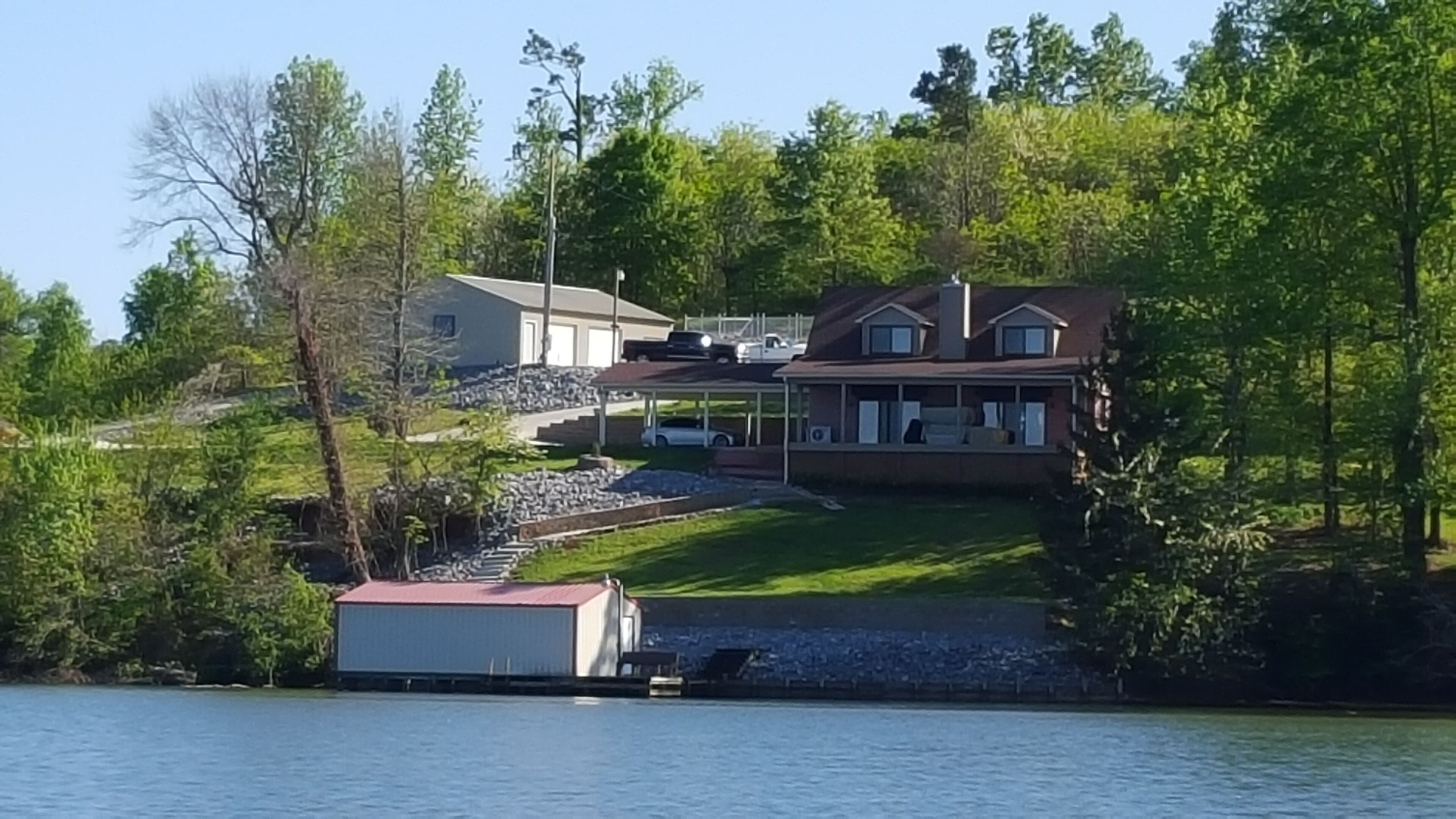 Main Channel Lake Guntersville waterfront home with beautiful view & deep water.