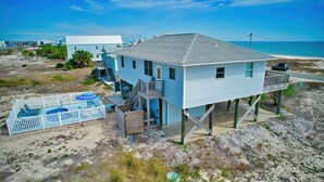A coastal house with a balcony, a pool, and a beach view. - Blue Wave 🌊 Beach Front View  🌞 Private Pool 🌴 Most Reviews on SGI (Apalachicola)