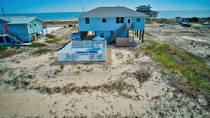 A beachfront house with a balcony, a small deck, and a view of the ocean. - Blue Wave 🌊 Beach Front View  🌞 Private Pool    🌴 Most Reviews on SGI (Apalachicola)