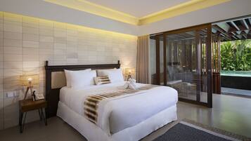 A modern hotel room with a large bed, bedside lamps, a small table with a phone, and a view of a pool through a glass door.