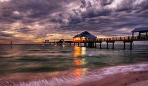 A pier extending into the water with a building at the end. - Luxury waterfront townhome - private rooftop patio (Clearwater Beach)