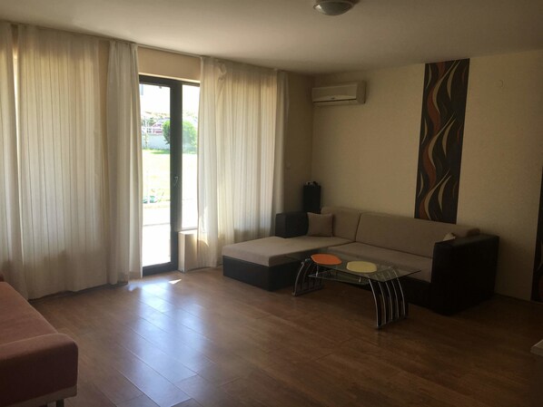 Comfort Apartment, 1 Bedroom | Living area | Flat-screen TV