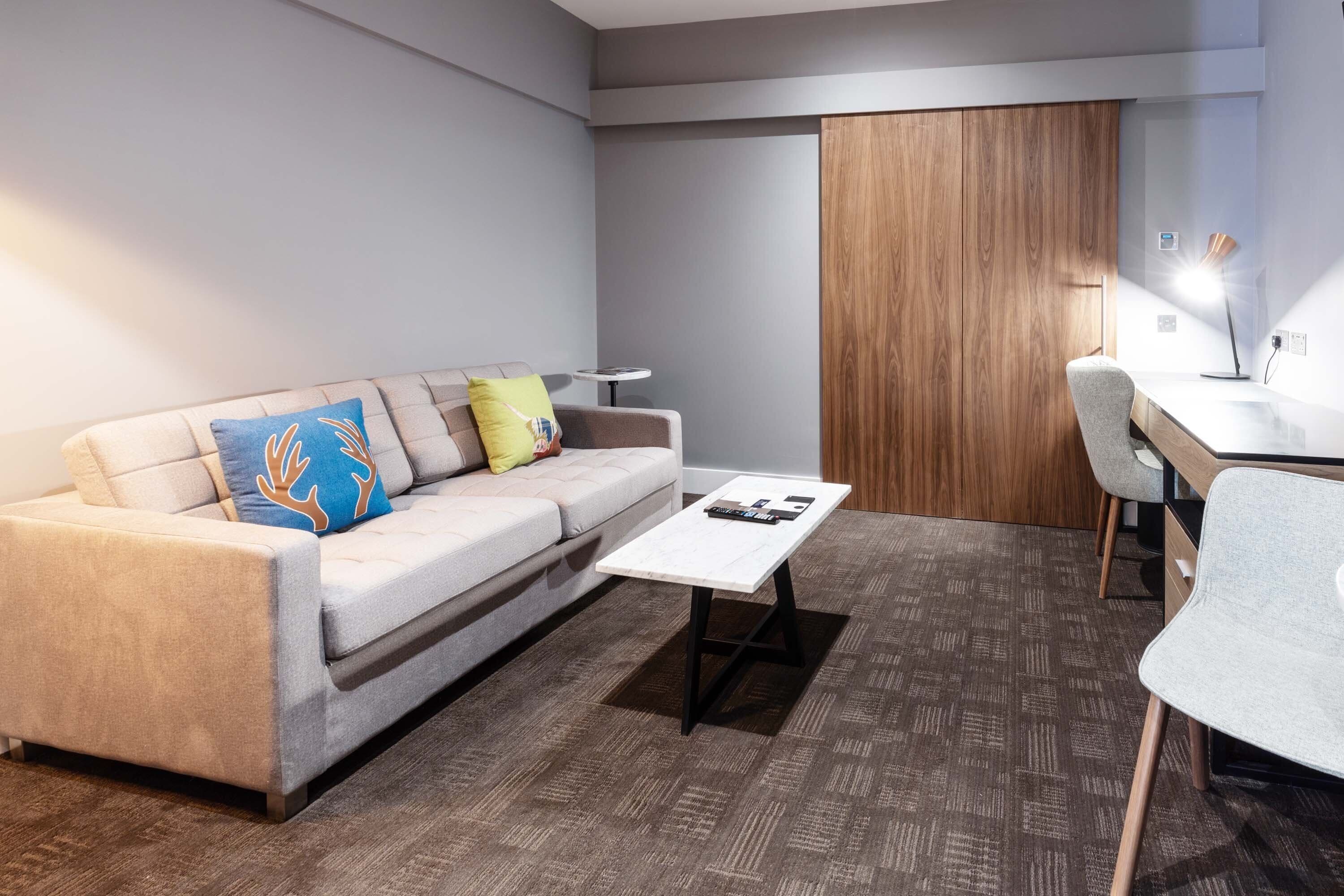 deluxe suite, 1 bedroom, 1 king, sofa bed, kitchenette | 1 bedroom, premium bedding, in-room safe, blackout curtains