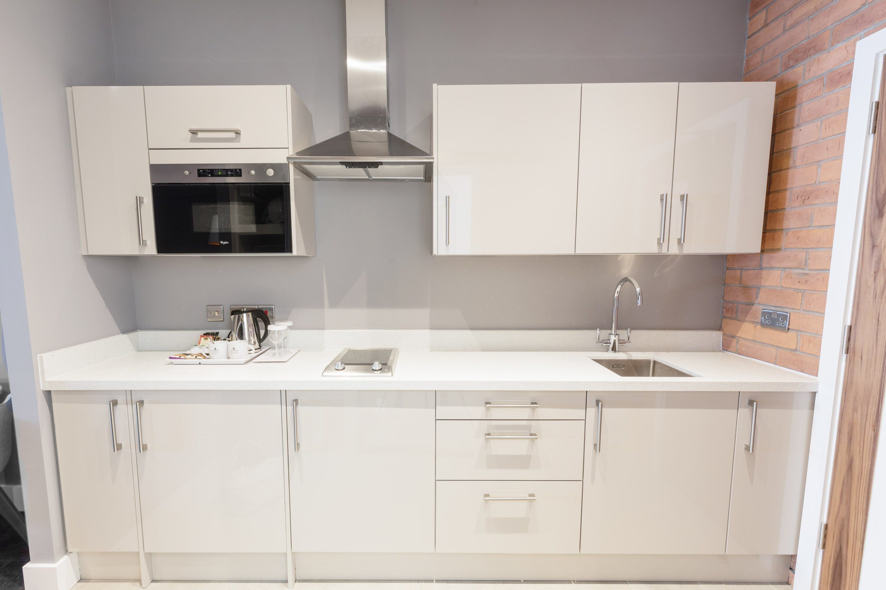 deluxe suite, 1 bedroom, 1 king, sofa bed, kitchenette | private kitchen | fridge, microwave, electric kettle