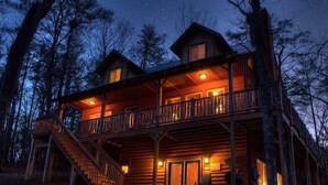 A wooden cabin with a balcony, stairs, and a porch area. - CROSS CREEK HIDEAWAY | MOUNTAINS | PET FRIENDLY (Sautee Nacoochee)