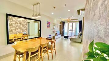 Design Apartment, 3 Bedrooms, City View | Living area | 54-inch flat-screen TV with cable channels, TV