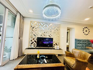 Family Apartment | Living area | 54-inch flat-screen TV with cable channels, TV - Scenic Valley Suite (Ho Chi Minh City)