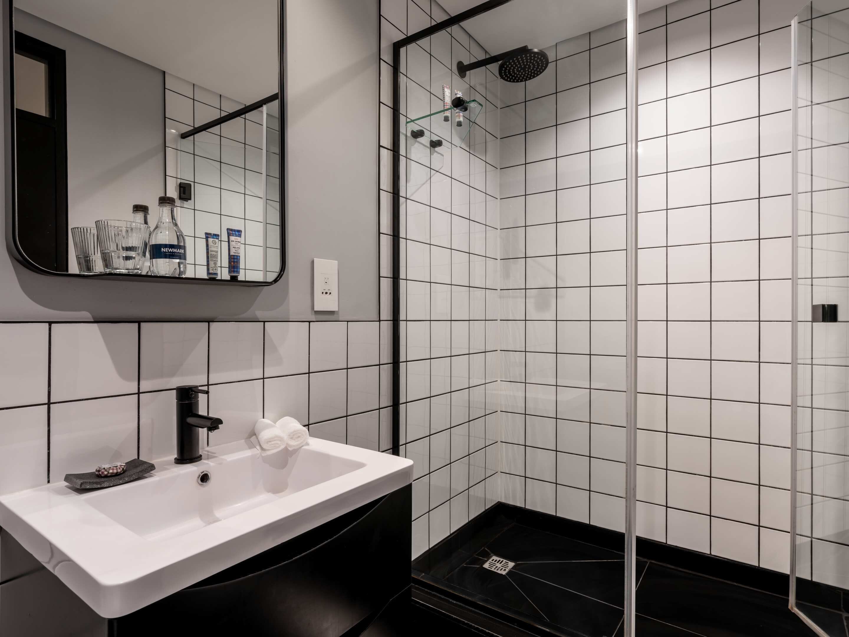 Studio, 1 King Bed, City View | Bathroom | Free toiletries, slippers, towels