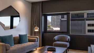 Studio, 1 King Bed, City View | Living area | Flat-screen TV