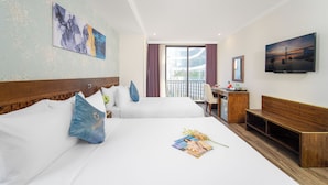 A hotel room with two beds, a desk, a TV, and a balcony with a view. - Grand Sea View Hotel & Spa (Da Nang)