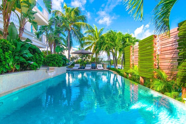 Outdoor pool, free pool cabanas, pool umbrellas