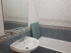 Deep soaking tub, rainfall showerhead, towels