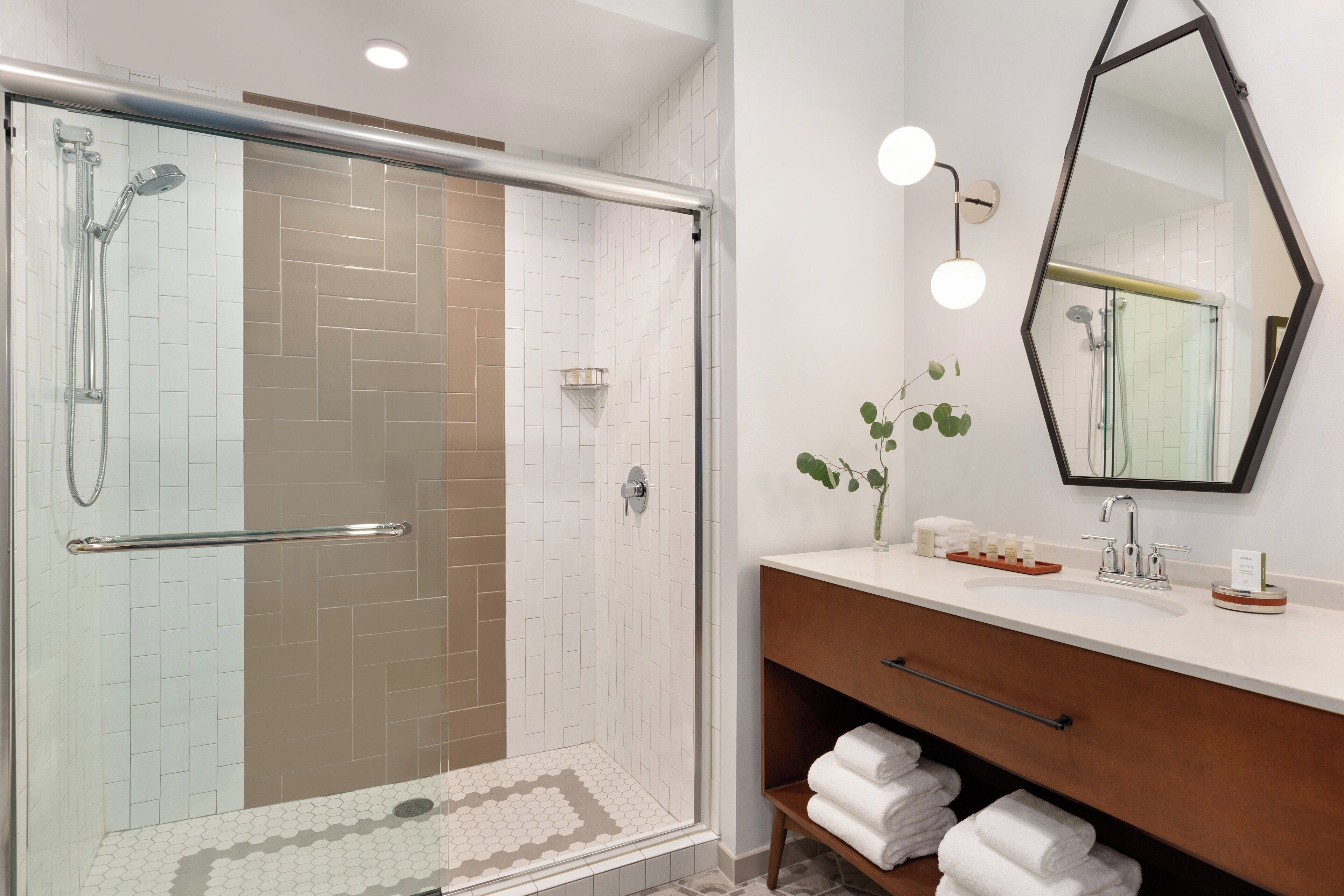 designer toiletries, hair dryer, bathrobes, towels