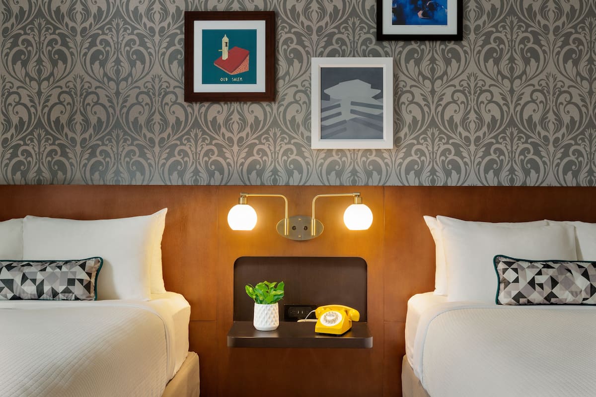 Premium bedding, pillow-top beds, desk, laptop workspace