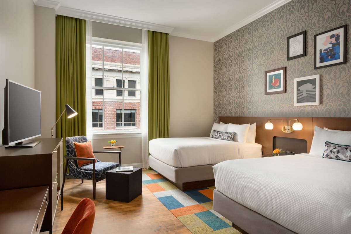 Premium bedding, pillow-top beds, desk, laptop workspace